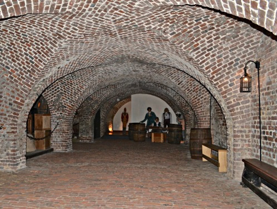The Old Exchange and Provost Dungeon was built in 1771 as a commercial exchange and custom house. It has served a variety of functions including a prisoner of war facility and the site of a fancy dress ball for George Washington.